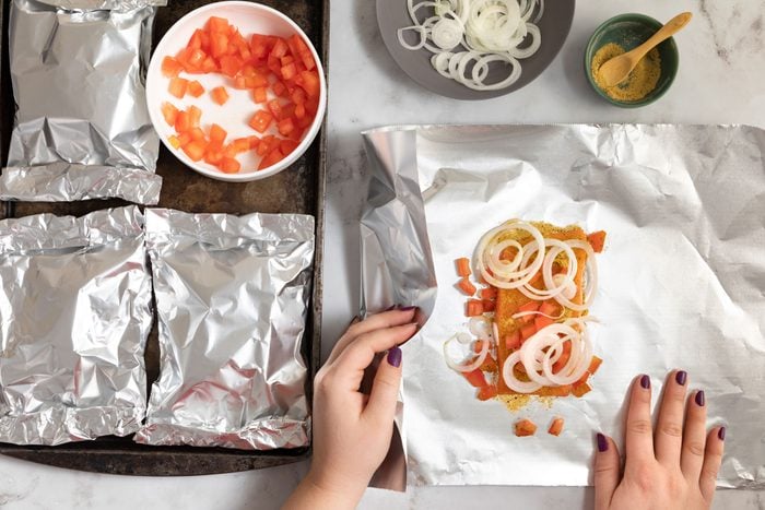 Fold the foil over fish and seal tightly