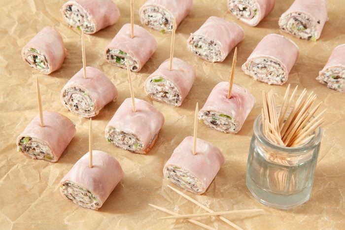 Ham Roll Ups on wooden surface