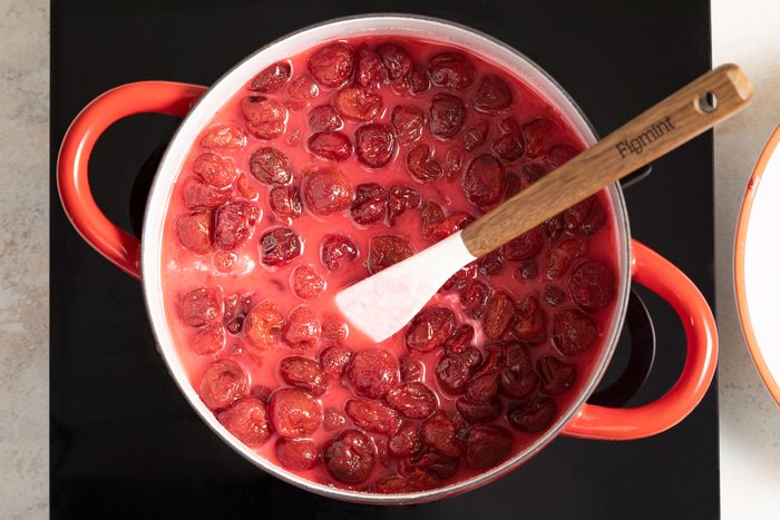 Cooking the cherries in saucepan