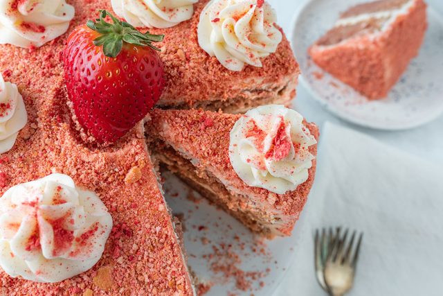 Slice of strawberry crunch cake on plate