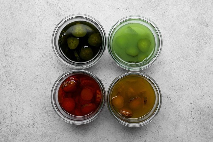A group of jars of different colour Pickles