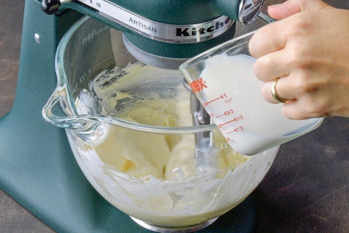 Mixing milk and cream cheese in a mixer