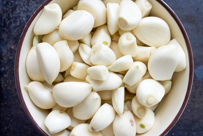 Peeled Garlic Cloves In A Bowl Top View