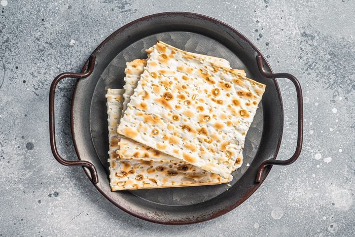 Pieces Of Matzah Matzo In A Vintage Steel Tray On Gray Background