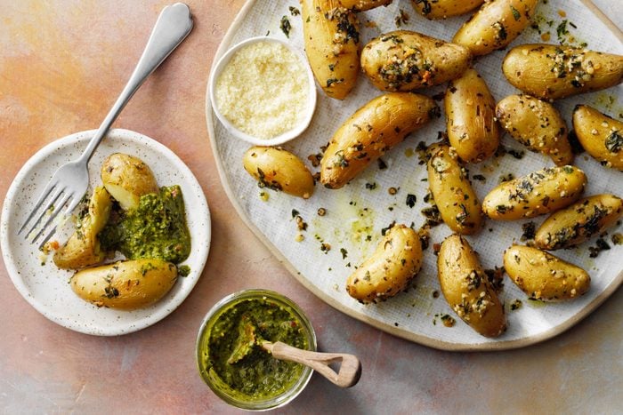 Roasted fingerling potatoes with pesto sauce on a plate