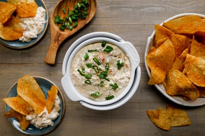 Sausage Cream Cheese Dip with chips served on a table