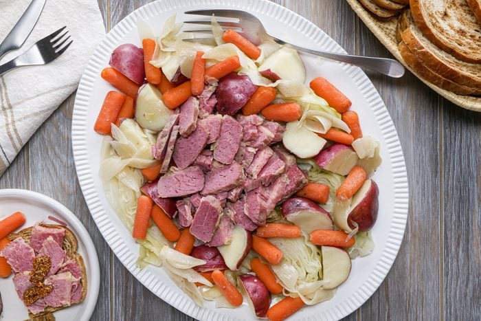 Slow Cooker Corned Beef served in a plate with other cooke vegetables