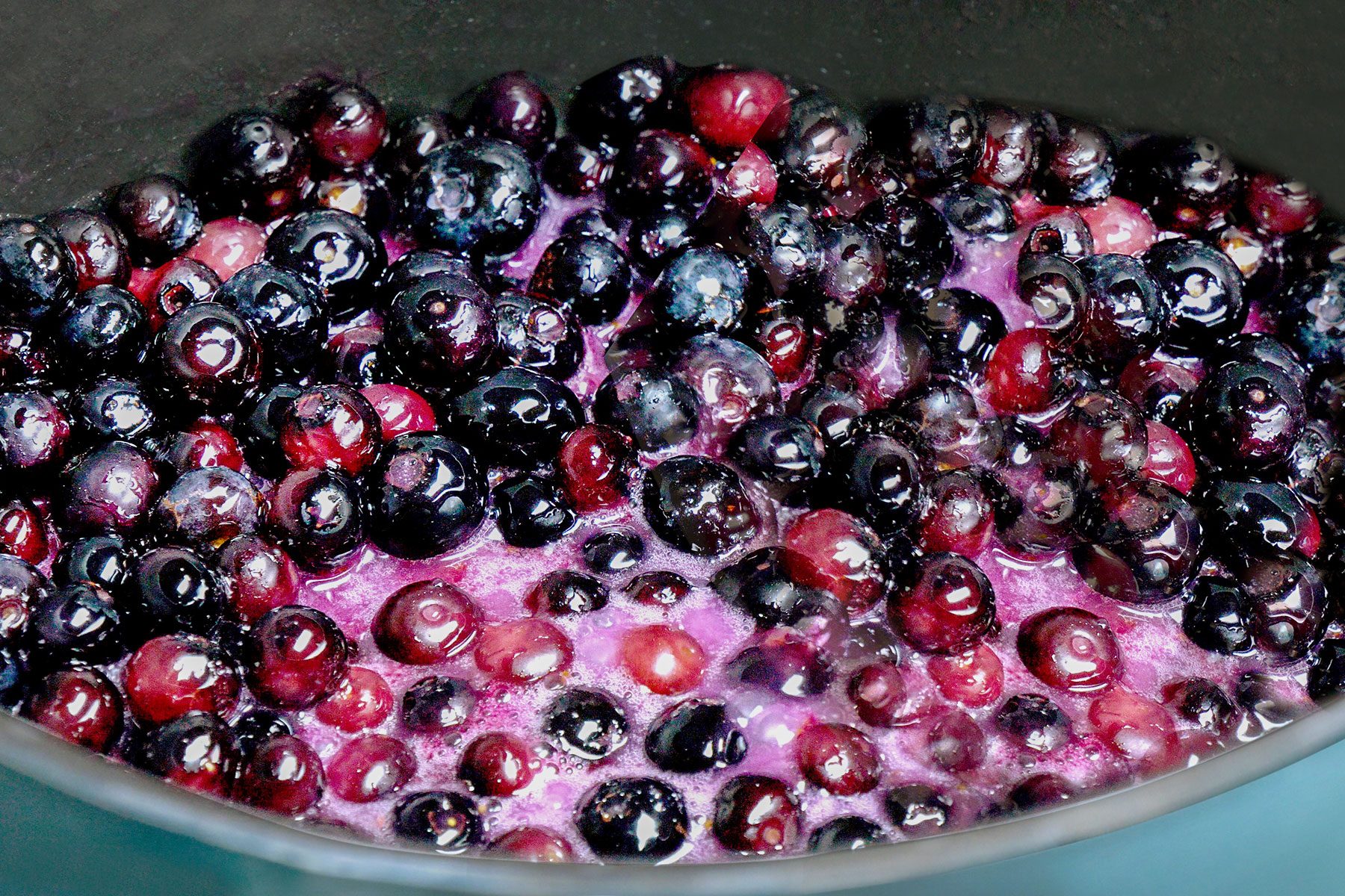 Blueberries cooking in pan