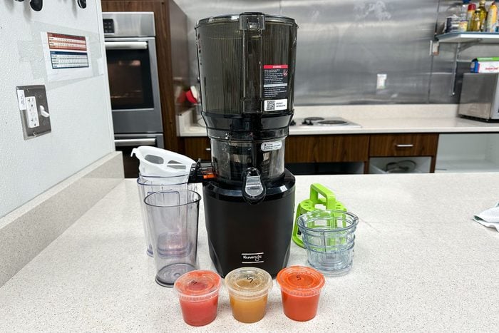 Kuvings Hands Free Slow Juicer Auto10 with different coloured cups