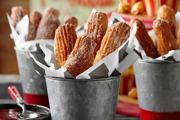 Air Fryer Churros served in metal glass 