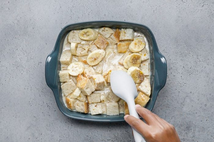 Stirring Bread and Banana Mixture in Bowl
