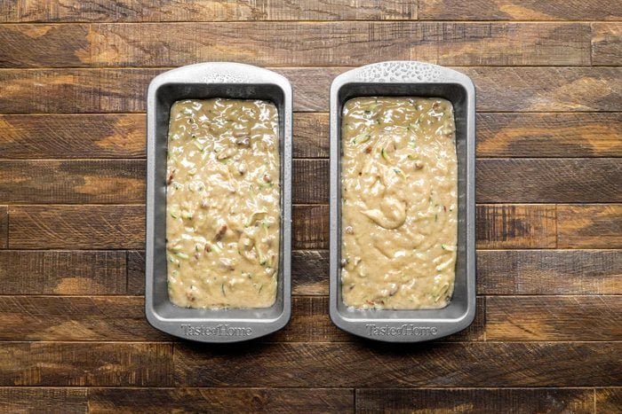 Pour the batter into two greased loaf pans