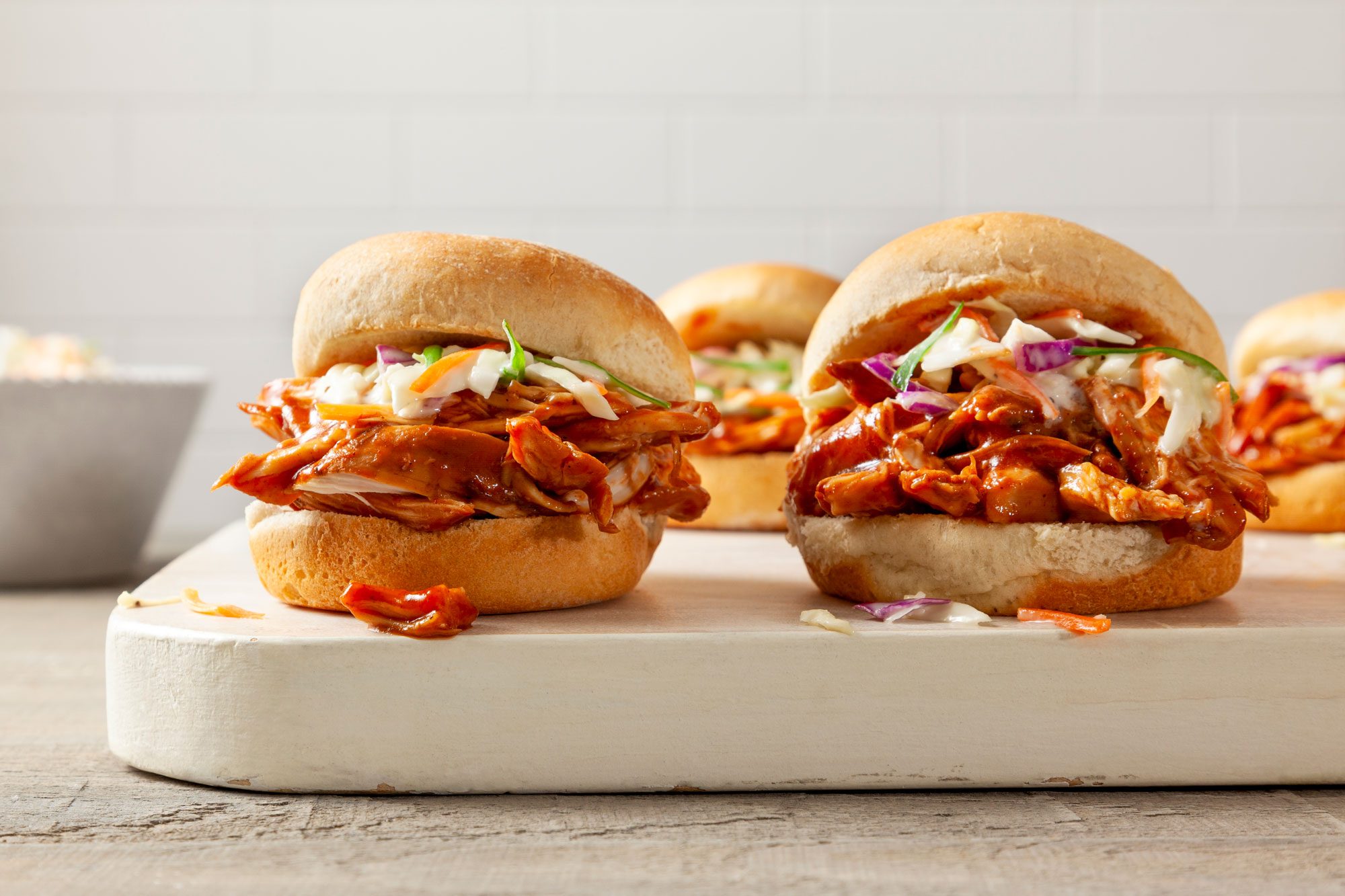 Barbecue Chicken Sliders on wooden surface