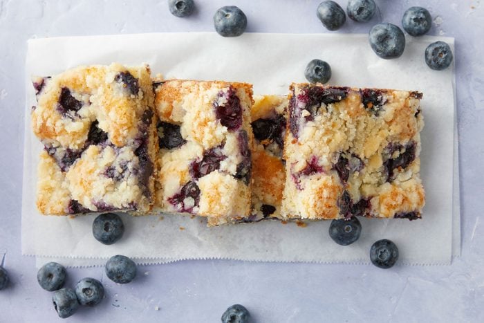 Blueberry Kuchen served with blue berries on a marble surface