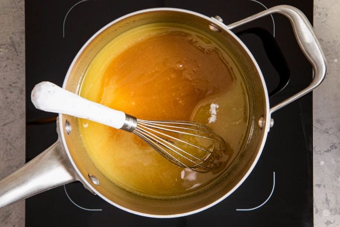 melted butter and brown sugar in a saucepan on induction cooktop