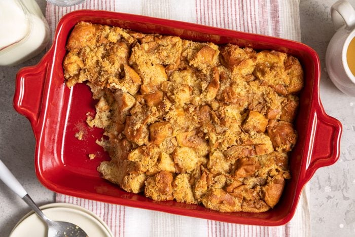 baked bread pudding in a large red baking dish