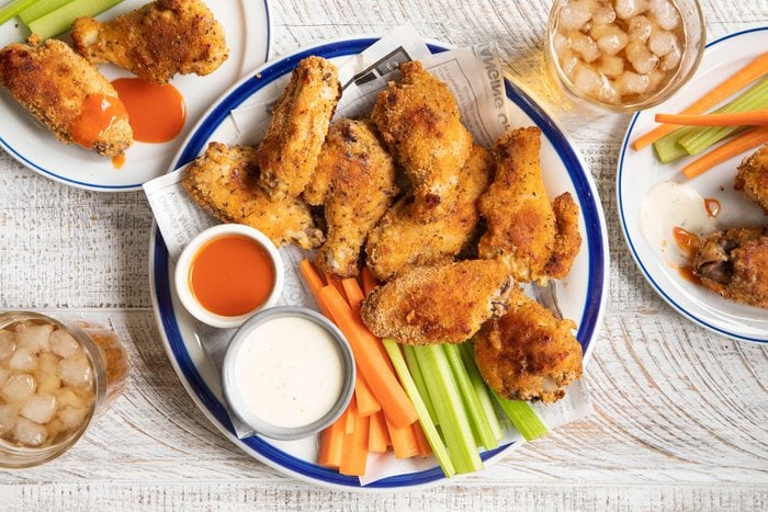 Chicken Wings served on a plate with dips 