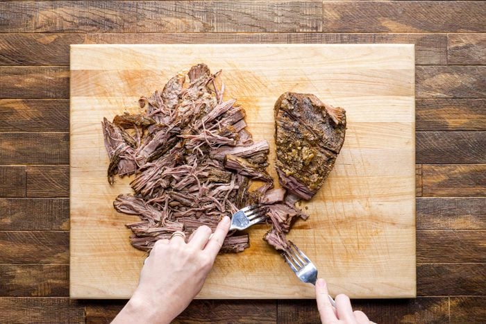 Shred the brisket using two forks