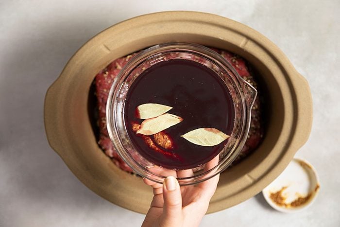 Red wine mixture with leaves in a glass bowl