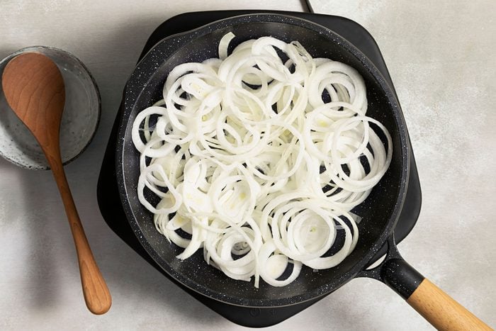 Sliced onions in a skillet 