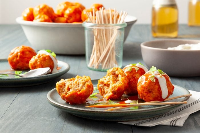 Buffalo Chicken Meatballs served on plate with celery