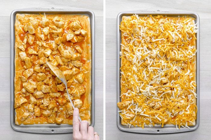Adding chicken and cheese over pizza on a baking tray