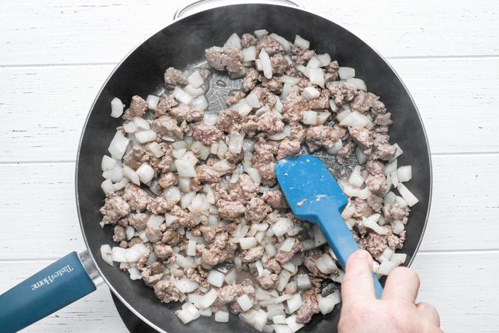 Cooking Beef and onion in a large skillet