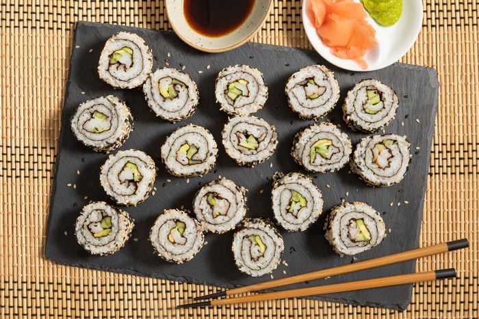 California Roll served with wasabi and soy sauce with chopsticks 