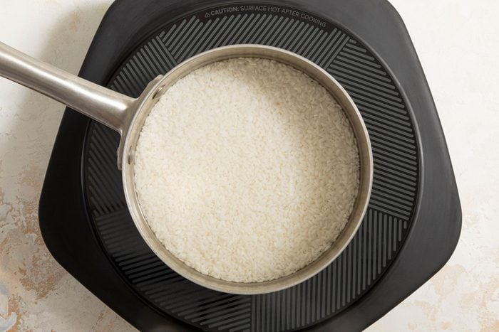 White Rice in a pot over electric stove top