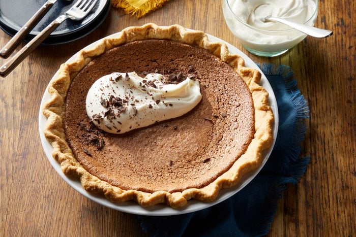 Delicious Chocolate Chess Pie topped with whipped cream