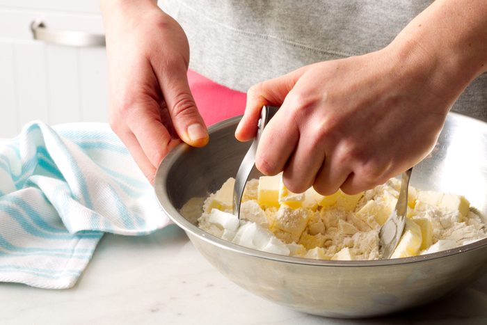 Using pastry blender to mix flour and cold butter