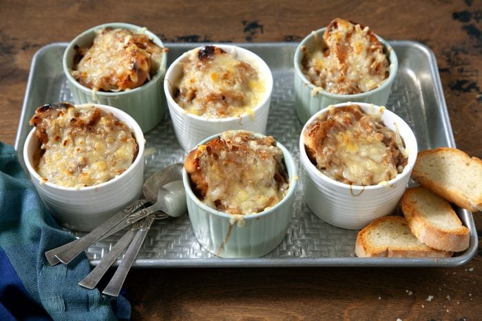 Classic French Onion Soup served with toast placed on a baking tray.