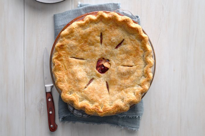 Cranberry Apple Pie served in a plate on a wooden table