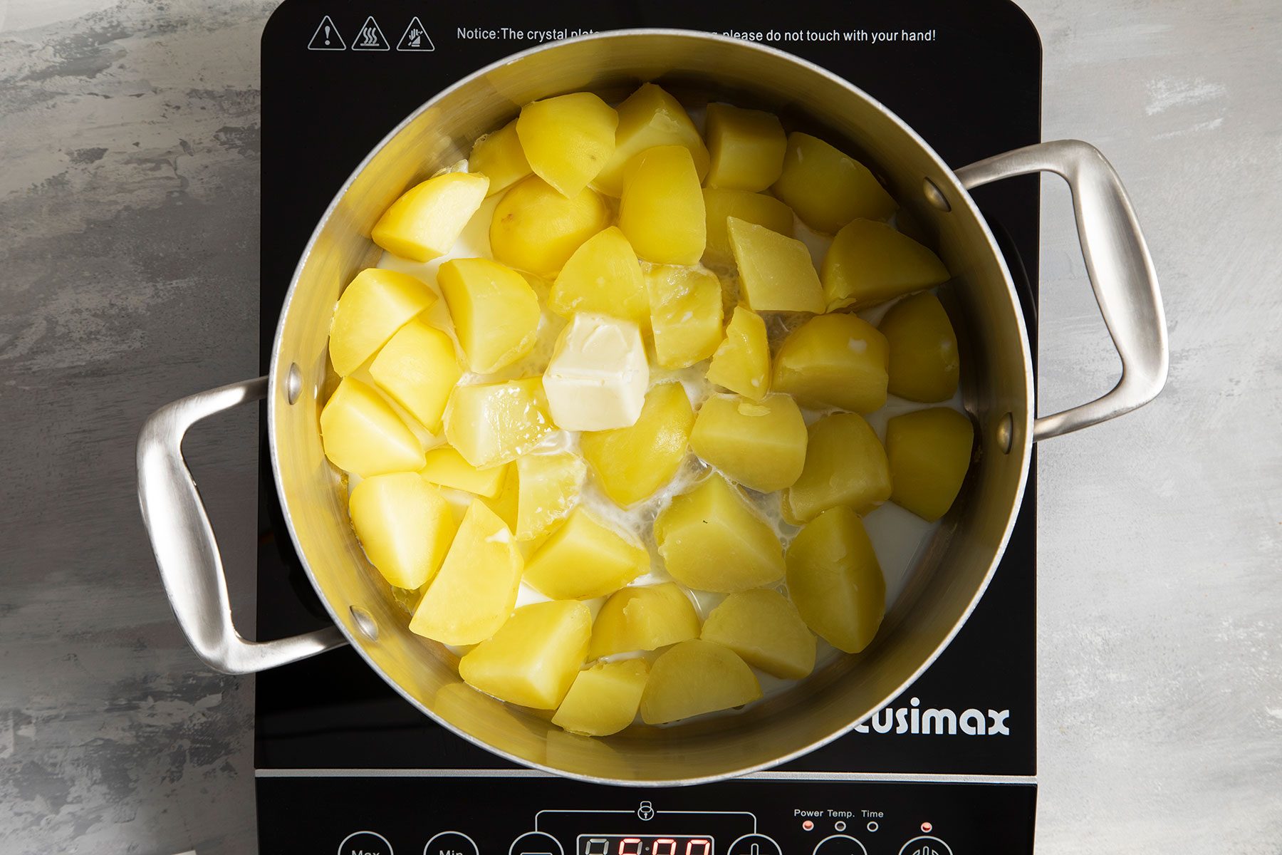 Potatoes cooking in saucepan