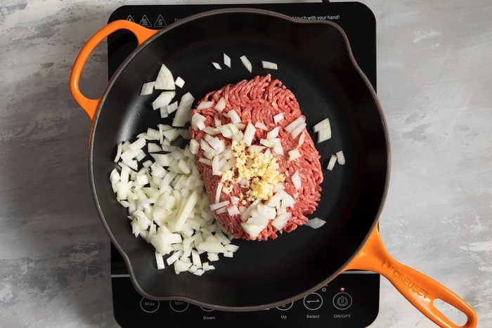 Minced meat and onions cooking in skillet