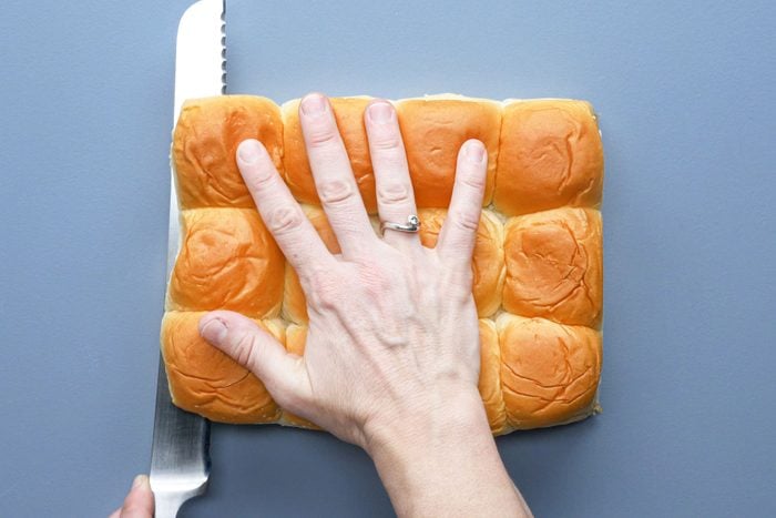 Cutting sweet rolls horizontally with a knife