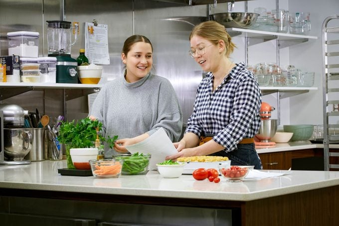 Culinary Producer Sarah Tramonte And Associate Culinary Producer Ellen Crowley in the Taste of Home Test Kitchen