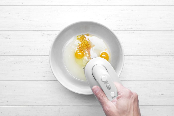 Using hand mixer beat the eggs, sugar, oil, vanilla and lemon zest