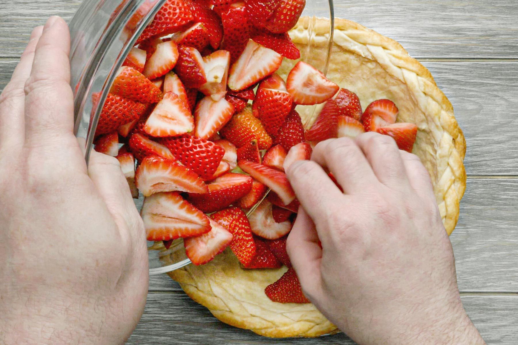 Arranging the strawberries on pie crust