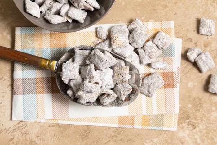 Easy Puppy Chow in a large serving spoon