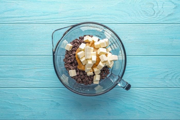 Combine the chocolate chips, peanut butter and butter in a large bowl