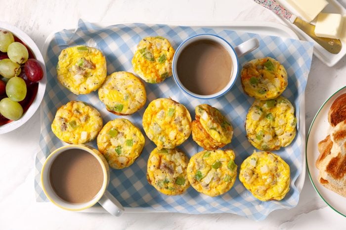 Egg Muffins served in a tray with tea on side.