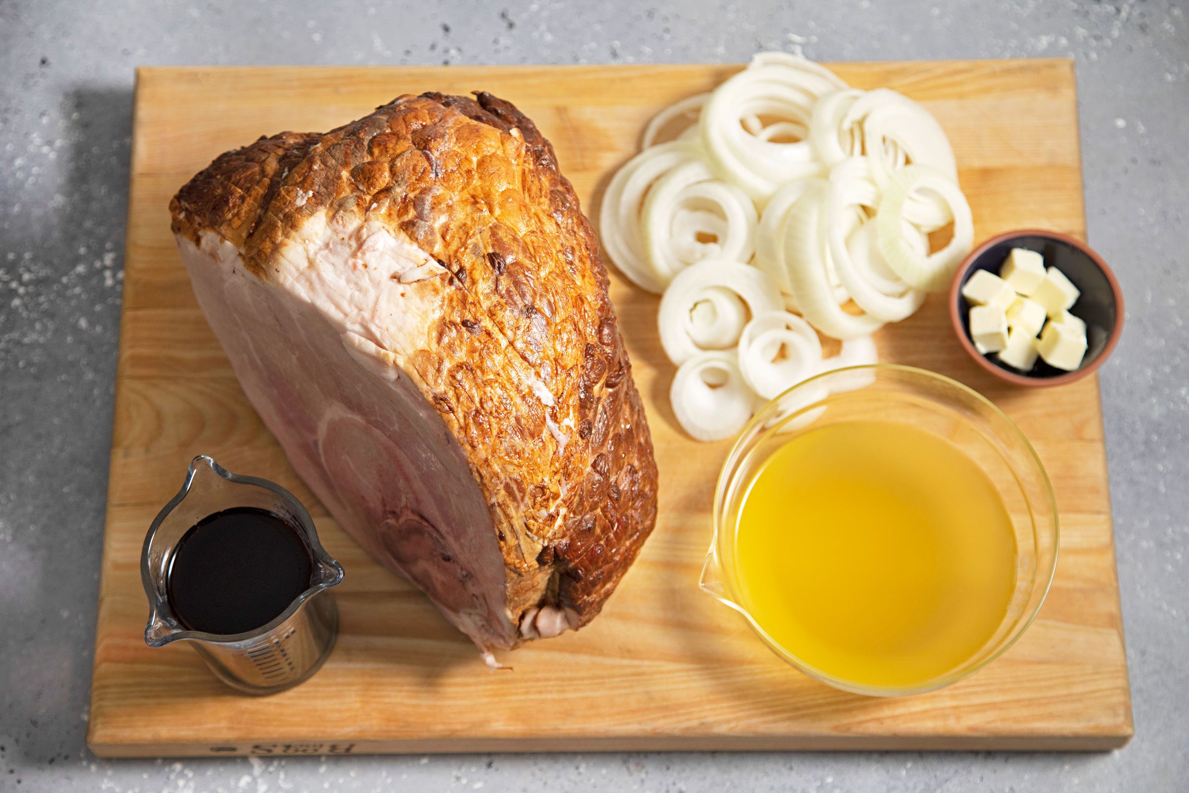 ingredients for Baked Spiral Ham on a wooden cutting board