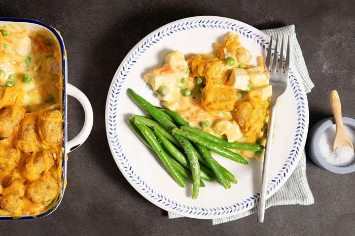 Chicken Tater Bake on a plate with green beans