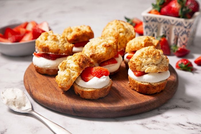 mini Strawberry Shortcake Cups on a wooden plate