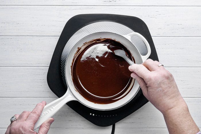 Melting chocolate in sauce pan over heat