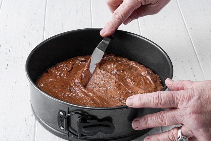 Spreading the chocolate batter in baking tray
