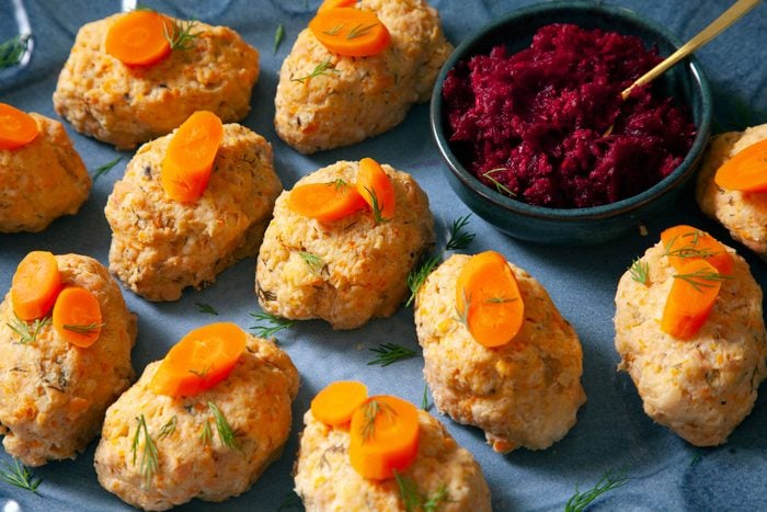 Closeup of Gefilte Fish served in a plate with carrots on top