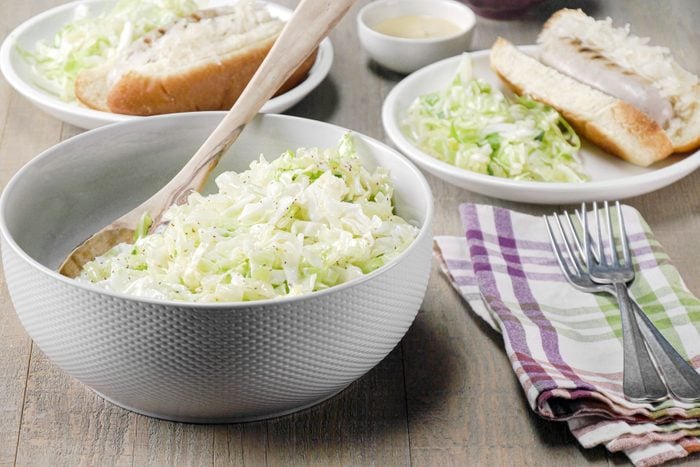 German Coleslaw served in a large bowl in breads on the side