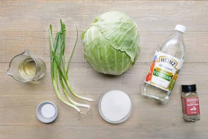 Cabbage vinegar and other ingredients on a wooden table